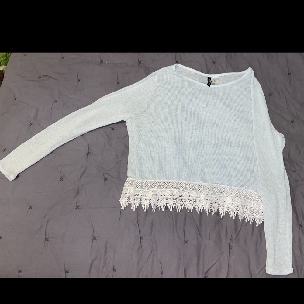 See through baby blue blouse, white lace at bottom